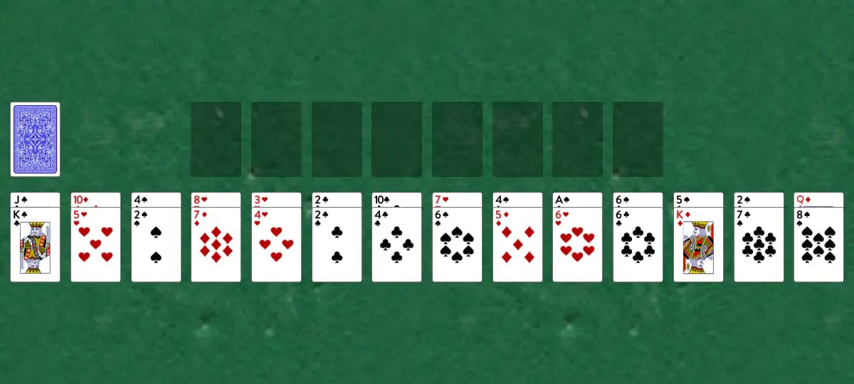 The opening deal of Barricade B Solitaire, laid out on a green felt table.