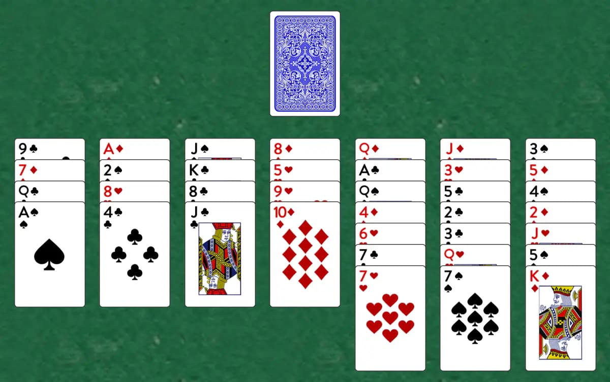 The opening deal of Chelicera Solitaire, laid out on a green felt table.