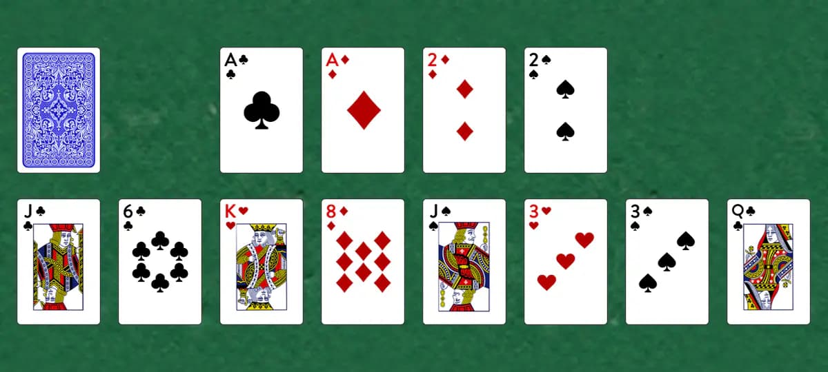 The opening deal of Double Dot Solitaire, laid out on a green felt table.