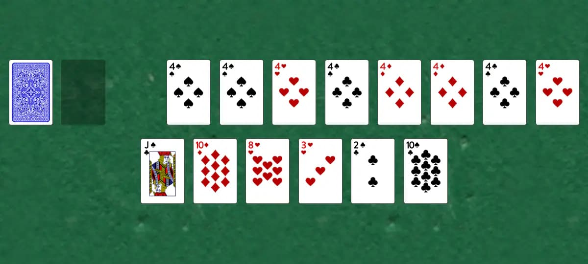 The opening deal of Fours Up Solitaire, laid out on a green felt table.