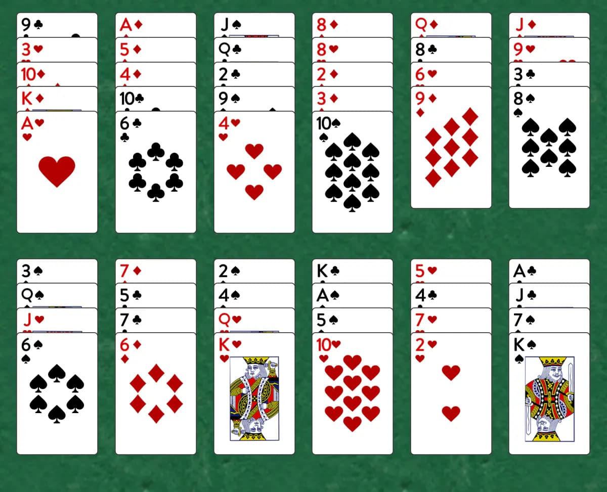 The opening deal of Fourteen Out Solitaire, laid out on a green felt table.