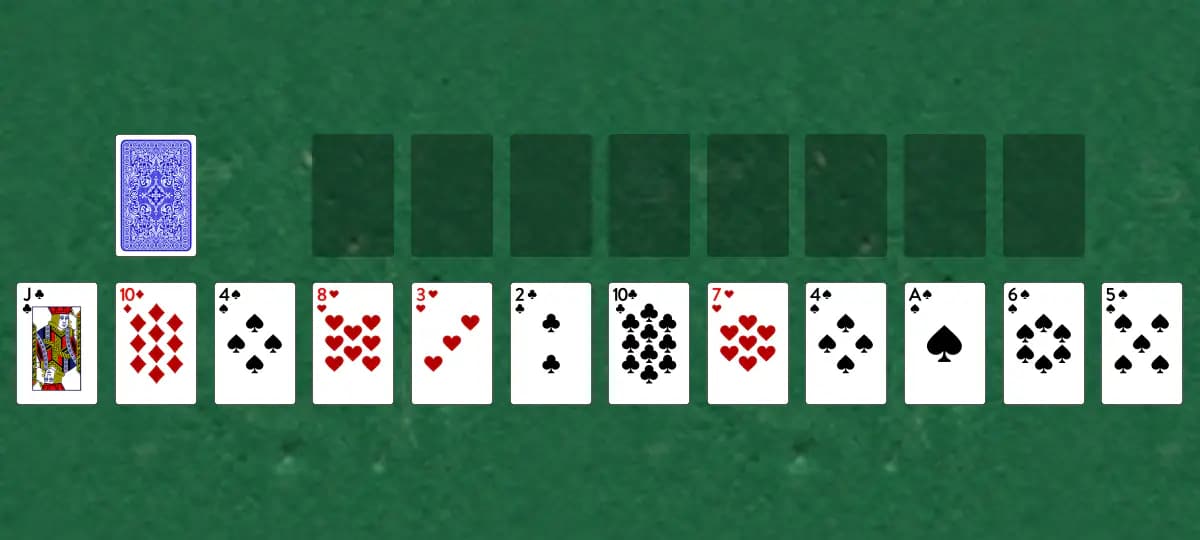 The opening deal of Blockade Solitaire, laid out on a green felt table.
