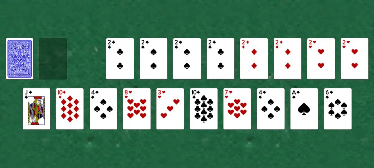 The opening deal of Deuces Solitaire, laid out on a green felt table.