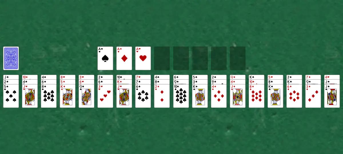 The opening deal of Intelligence Solitaire, laid out on a green felt table.