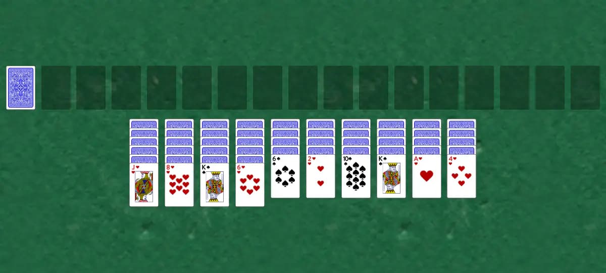 The opening deal of Spider Two Suits Solitaire, laid out on a green felt table.